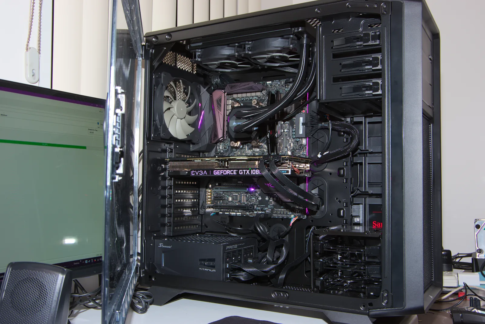 Completed gaming desktop PC build showing motherboard, graphics card and cooling inside the case